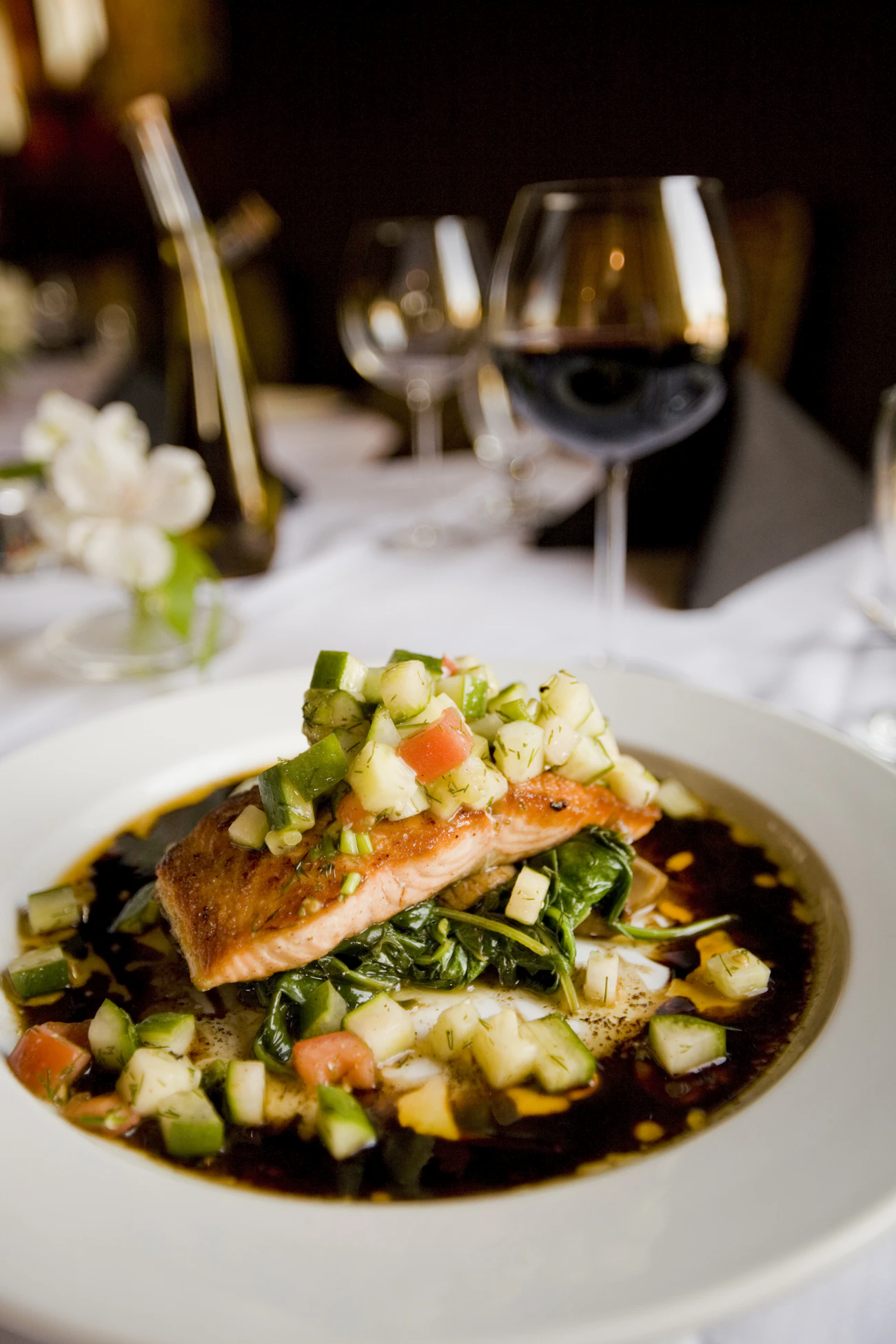A refined plated course at a fine table