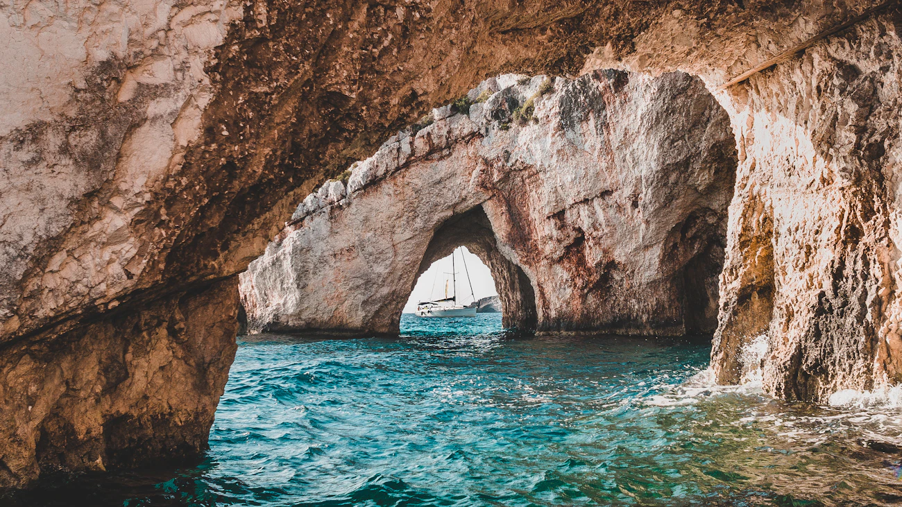 Boats resting inside a rocky sea cove