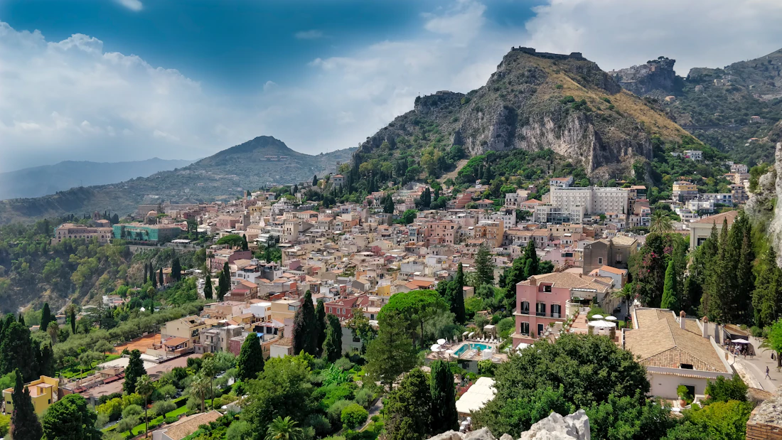 The town of Taormina with Mount Etna rising behind it