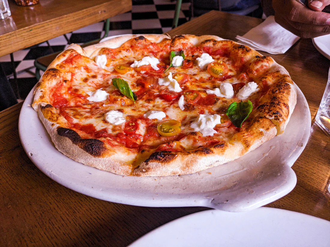 A wood-fired Neapolitan pizza margherita