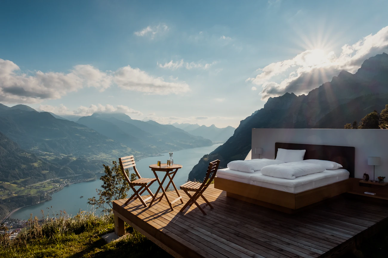A bed on a cliff terrace high above the sea