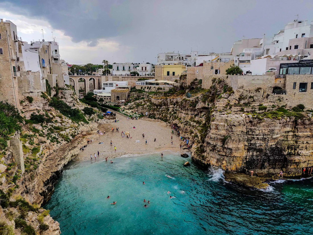A turquoise cove beneath the cliffs of the Puglian coast